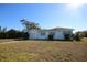 Cute ranch home with aqua shutters and large yard at 801 Woodruff Ave, Clearwater, FL 33756