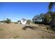 White house with aqua shutters and expansive yard at 801 Woodruff Ave, Clearwater, FL 33756