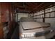 Garage with overhead door and storage shelves at 801 Woodruff Ave, Clearwater, FL 33756