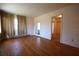 Hardwood floor living room with French doors and access to other rooms at 801 Woodruff Ave, Clearwater, FL 33756