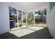 Spacious screened porch with view of backyard at 801 Woodruff Ave, Clearwater, FL 33756