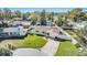 House with a yard, driveway and pool in a residential neighborhood at 11398 88Th Ave, Seminole, FL 33772