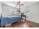 Comfortable bedroom featuring wood flooring and window coverings at 11398 88Th Ave, Seminole, FL 33772