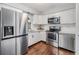 Updated kitchen featuring stainless steel appliances and white cabinets at 11398 88Th Ave, Seminole, FL 33772