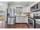 Bright kitchen with stainless steel appliances and marble countertops at 11398 88Th Ave, Seminole, FL 33772