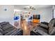 Open concept living area with hardwood floors and recessed lighting at 11398 88Th Ave, Seminole, FL 33772
