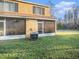 Backyard view of townhouse and green lawn at 1241 Redondo Way, Wesley Chapel, FL 33543