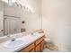 Bathroom with double vanity and bathtub at 1241 Redondo Way, Wesley Chapel, FL 33543