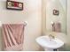 Clean bathroom with pedestal sink and an updated mirror at 1241 Redondo Way, Wesley Chapel, FL 33543