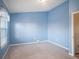 Light blue bedroom with carpeting and double door closet at 1241 Redondo Way, Wesley Chapel, FL 33543