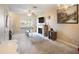 Bright living room with fireplace, tiled floors, and built-in shelving at 1241 Redondo Way, Wesley Chapel, FL 33543