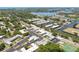 Aerial view showcasing Green Dolphin community near water and golf course at 1250 S Pinellas Ave # 713, Tarpon Springs, FL 34689