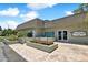 The Green Dolphin Club community clubhouse with entrance and landscaping at 1250 S Pinellas Ave # 713, Tarpon Springs, FL 34689