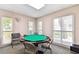 Community game room with an octagonal game table and seating at 1250 S Pinellas Ave # 713, Tarpon Springs, FL 34689