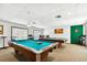 Community game room with two pool tables and a dartboard at 1250 S Pinellas Ave # 713, Tarpon Springs, FL 34689