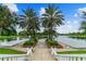 Picturesque lakefront with palm trees and walkway at 1250 S Pinellas Ave # 713, Tarpon Springs, FL 34689