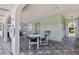 Community pool area with tables and chairs for relaxation at 1250 S Pinellas Ave # 713, Tarpon Springs, FL 34689