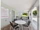 Community pool area with tables and chairs at 1250 S Pinellas Ave # 713, Tarpon Springs, FL 34689