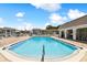 Sparkling community pool with surrounding patio at 1250 S Pinellas Ave # 713, Tarpon Springs, FL 34689