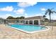 Inviting community pool with patio and building view at 1250 S Pinellas Ave # 713, Tarpon Springs, FL 34689