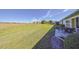 Large backyard with grassy area at 1318 Leland Dr, Sun City Center, FL 33573