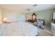 Large bedroom with king-size bed, ample closet space, and ceiling fan at 1318 Leland Dr, Sun City Center, FL 33573