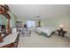Spacious bedroom with king-size bed, built-in shelving, and ceiling fan at 1318 Leland Dr, Sun City Center, FL 33573