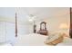 Bedroom with four-poster bed, ceiling fan, and ample closet space at 1318 Leland Dr, Sun City Center, FL 33573