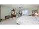 King-size bed, ample closet space, and ceiling fan in this large bedroom at 1318 Leland Dr, Sun City Center, FL 33573