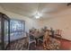 Elegant dining room features hardwood floors, ornate chairs, and a large window at 1318 Leland Dr, Sun City Center, FL 33573