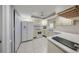 White kitchen with stainless steel appliances and ample counter space at 1318 Leland Dr, Sun City Center, FL 33573