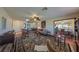 Open living room with hardwood floors, comfortable seating, and access to the dining area at 1318 Leland Dr, Sun City Center, FL 33573