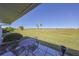 Patio overlooking a grassy area at 1318 Leland Dr, Sun City Center, FL 33573