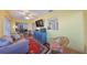 Sunroom offers a relaxing space with a view, hardwood floors, and built-in shelving at 1318 Leland Dr, Sun City Center, FL 33573
