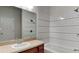 Bathroom with white tile, tub, and a large vanity at 1610 Bonita Bluff Ct, Ruskin, FL 33570