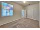 Well-lit bedroom featuring carpet and a double-door closet at 1610 Bonita Bluff Ct, Ruskin, FL 33570