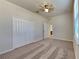 Bright bedroom with ceiling fan, double doors closet and carpet flooring at 1610 Bonita Bluff Ct, Ruskin, FL 33570