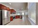 Modern kitchen with stainless steel appliances and wood cabinets at 1610 Bonita Bluff Ct, Ruskin, FL 33570