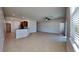 Open living room and kitchen area with tile floors at 1610 Bonita Bluff Ct, Ruskin, FL 33570