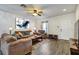 Bright and airy living room with hardwood floors and comfy furniture at 16314 Swan View Cir, Odessa, FL 33556