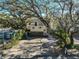 Aerial view of a two-story house with a large yard and mature trees at 1745 E Mulberry Dr, Tampa, FL 33604