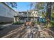 Charming backyard with a brick patio and lush landscaping at 1745 E Mulberry Dr, Tampa, FL 33604