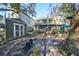 View of the back of the house, a shed, and a brick pathway at 1745 E Mulberry Dr, Tampa, FL 33604