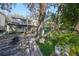 Landscaped backyard pathway leading to a charming two-story home at 1745 E Mulberry Dr, Tampa, FL 33604