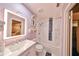 Charming bathroom with a lavender color scheme and updated fixtures at 1745 E Mulberry Dr, Tampa, FL 33604