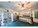 Bright bedroom featuring a comfortable bed and access to a balcony overlooking nature at 1745 E Mulberry Dr, Tampa, FL 33604