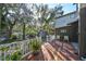 Spacious deck with backyard view, shed, and trees at 1745 E Mulberry Dr, Tampa, FL 33604