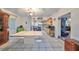 Open dining area with large table, adjacent to kitchen at 1745 E Mulberry Dr, Tampa, FL 33604