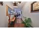 Bright and spacious entryway with hardwood floors, a long console table, and artwork at 1745 E Mulberry Dr, Tampa, FL 33604