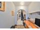 Home office with wood desk and view to staircase at 1745 E Mulberry Dr, Tampa, FL 33604